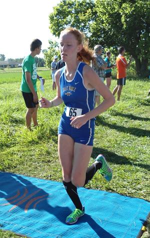Senior Alexia Zawadzke crosses the finish line at a meet this year.