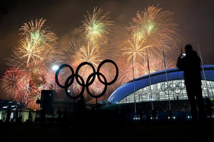 Fireworks are shot off behind the Olympic rings during the closing ceremony of the 2014 Sochi Olympic Games.