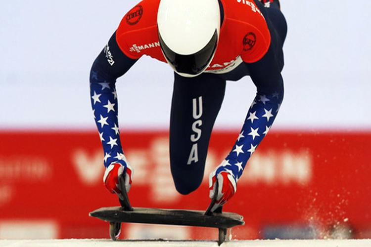 Team USAs Matthew Antoine mounts his sled in his bronze medal effort during the 2014 Sochi Olympics.