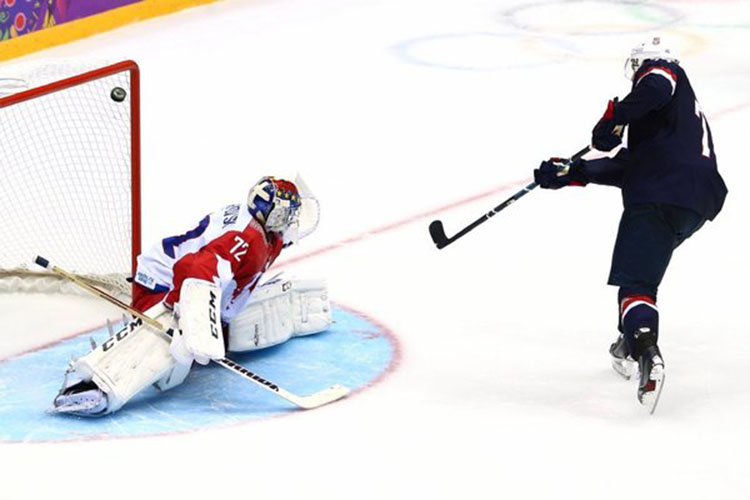 TJ Oshie, right, scores game-winning goal through the legs of Bobrovski, left, in a 3-2 victory.