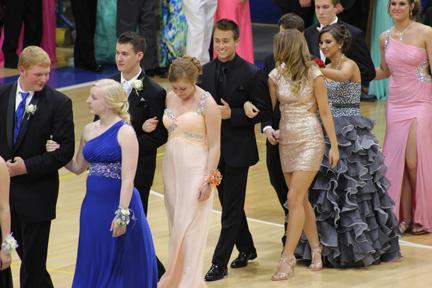 The couples make their trip through the gym during Grand March.