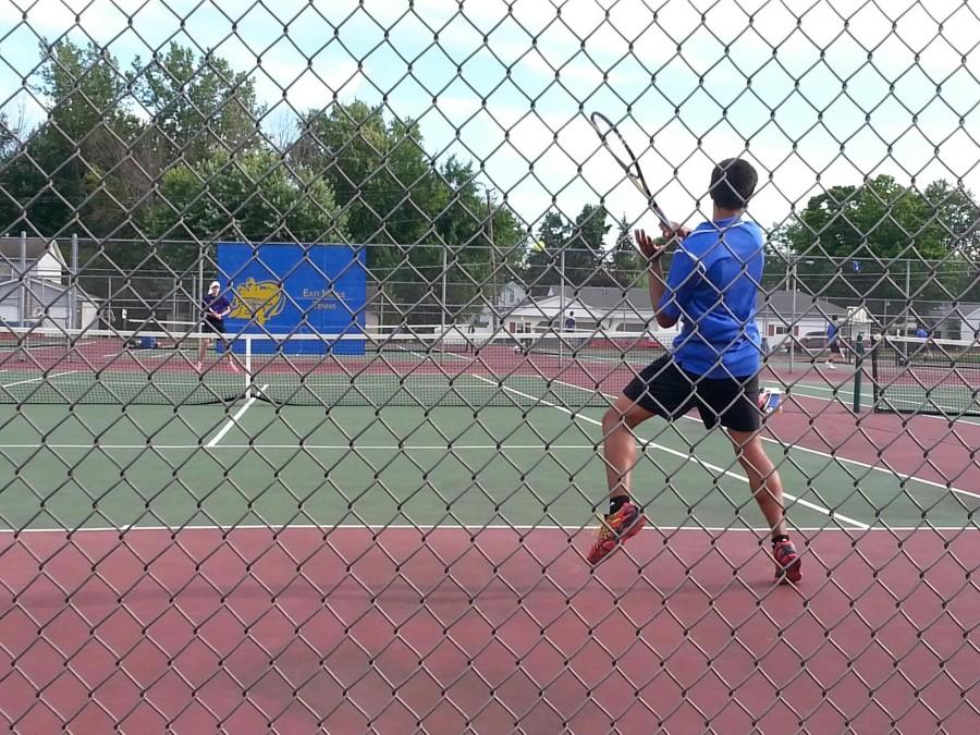 Sophomore Austin Mohamadali returns a serve during his match on Wednesday night.