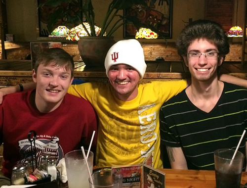 Taylor Lehman (middle) hangs out with two of his best friends, Jayson Arend (left) and Travis Gordon (right).