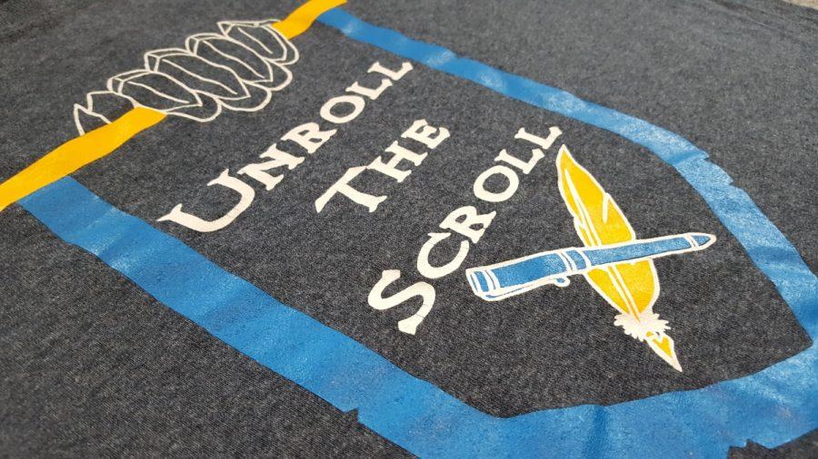 A Knightly Scroll logo on the clubs 2015-2016 school year T-shirt