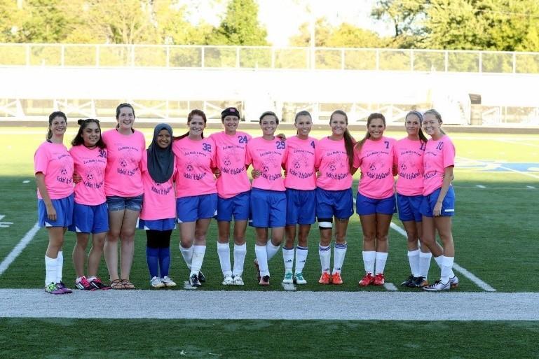 EN Seniors pose for a picture before their Kick it for Cancer soccer game. 